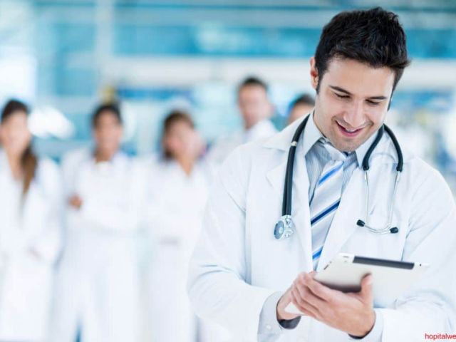 Doctor using tablet computer