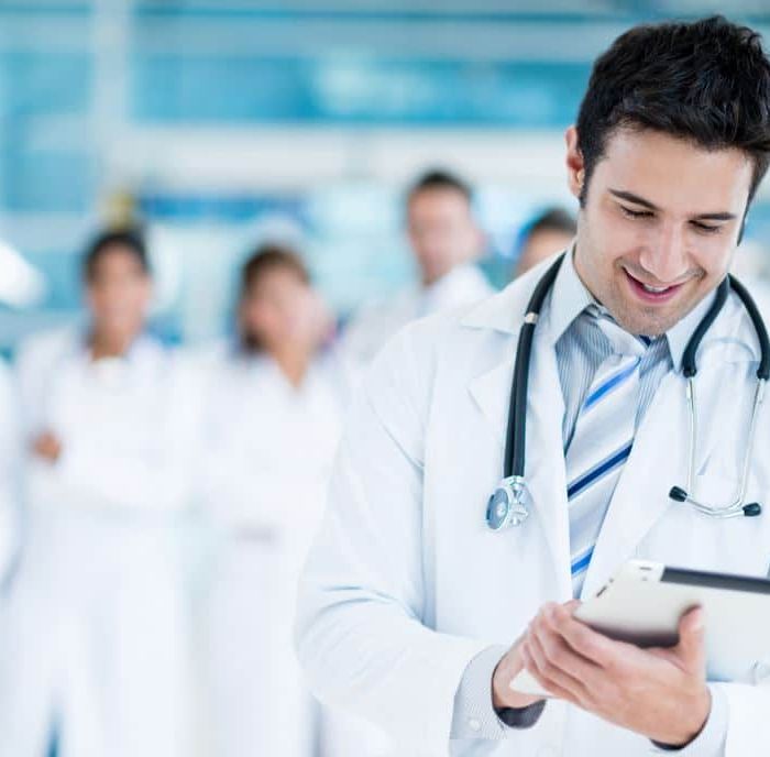 Doctor using tablet computer