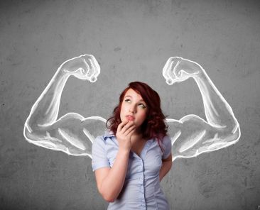 Pretty young woman with sketched strong and muscled arms
