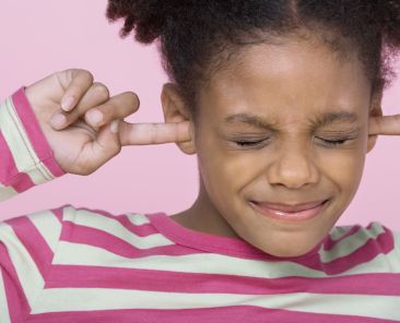 Girl with Fingers in Ears